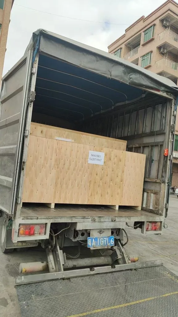 Actual photos of export order containers nearing full capacity; equipment is being loaded into the containers in order and properly secured and braced.