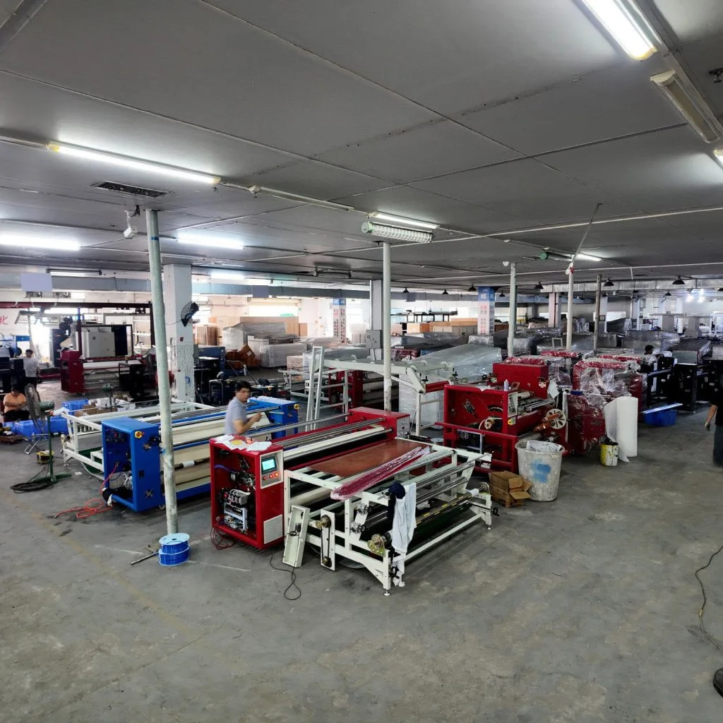 Actual footage from the production workshop of a Rotary Sublimation Transfer Machine, showing the assembly of the drum and heating system