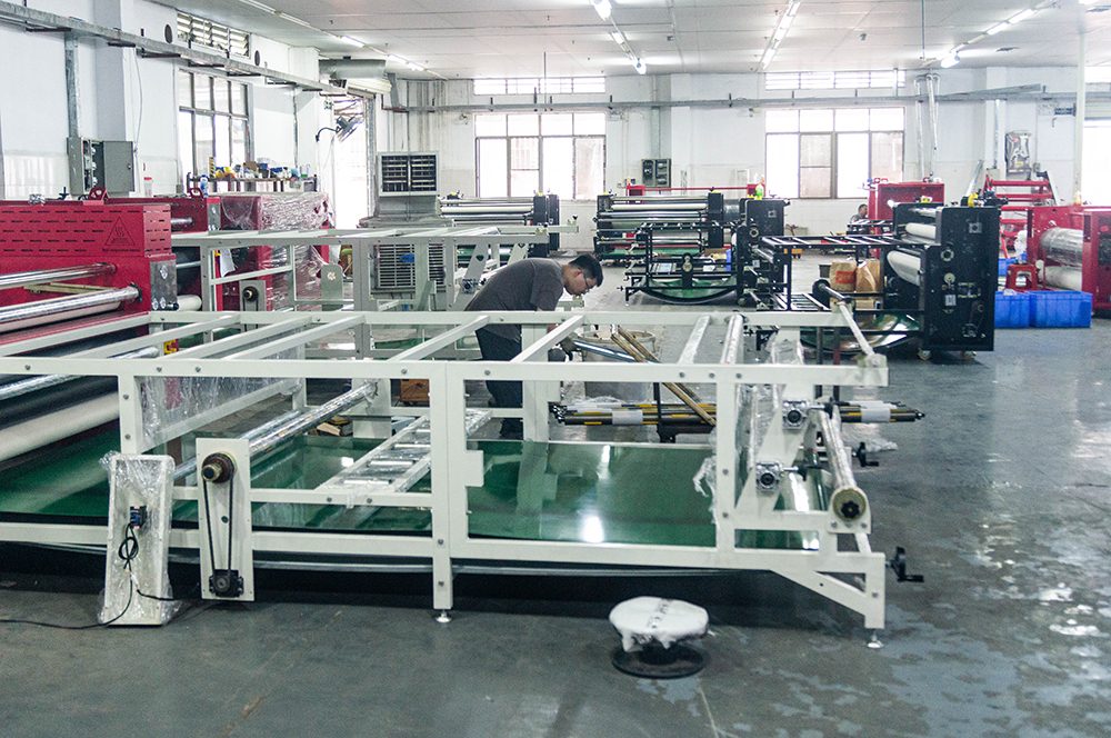 Scenes from the production floor of a Chinese printing equipment manufacturing plant